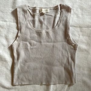 Cute ribbed crop top, styled well with gold jewelry in the summer months.